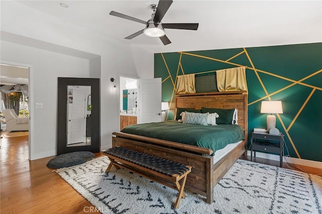 4835 Almidor Ave, Woodland Hills, CA 91364 - bedroom featuring wood finished floors, lofted ceiling, connected bathroom, and ceiling fan