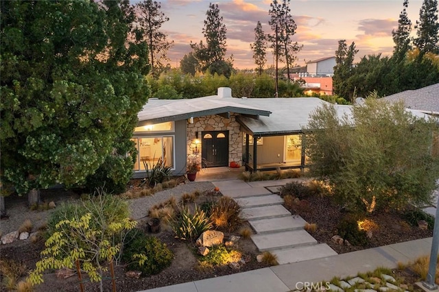 4835 Almidor Ave, Woodland Hills, CA 91364 - mid-century modern home featuring stone siding and a chimney