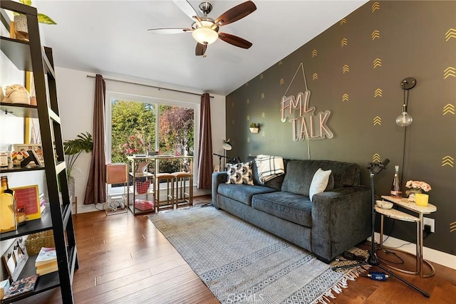 4835 Almidor Ave, Woodland Hills, CA 91364 - living area featuring ceiling fan, wood finished floors, an accent wall, and vaulted ceiling