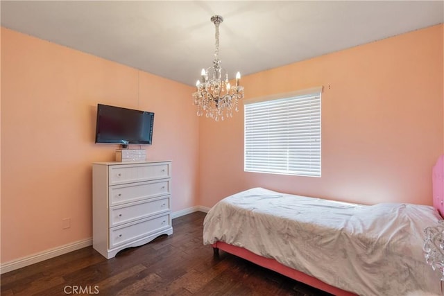 13238 Dancy St, Eastvale, CA 92880 - bedroom with a chandelier and dark wood-style flooring