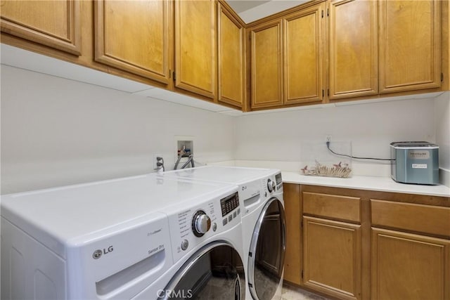 13238 Dancy St, Eastvale, CA 92880 - laundry room featuring washer and dryer and cabinet space