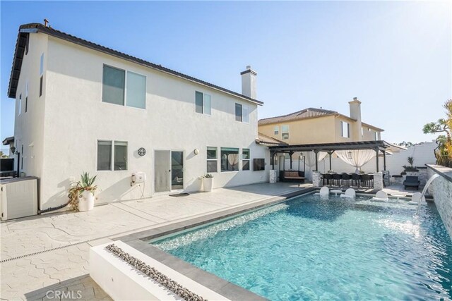 13238 Dancy St, Eastvale, CA 92880 - rear view of property with a patio area, stucco siding, a fenced backyard, and an outdoor hangout area