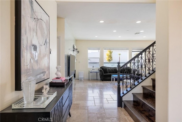 13238 Dancy St, Eastvale, CA 92880 - entrance foyer featuring stone tile flooring, stairs, and recessed lighting