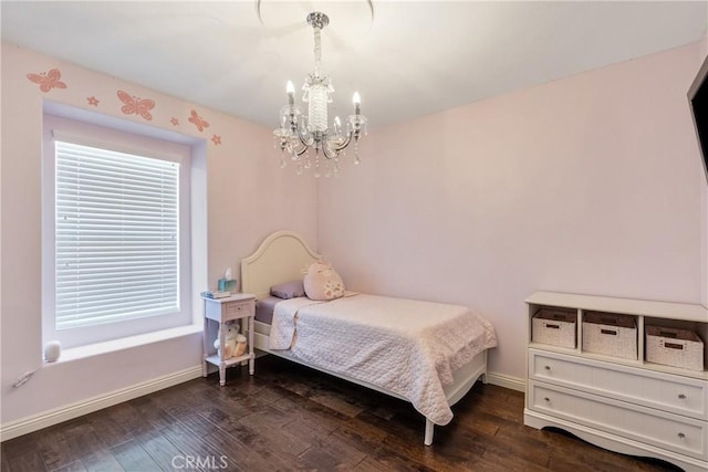 13238 Dancy St, Eastvale, CA 92880 - bedroom with a chandelier and dark wood-style flooring