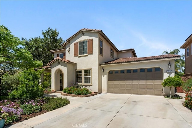28233 Millstream Ct, Menifee, CA 92585 - mediterranean / spanish-style home with driveway, stucco siding, a tile roof, and an attached garage