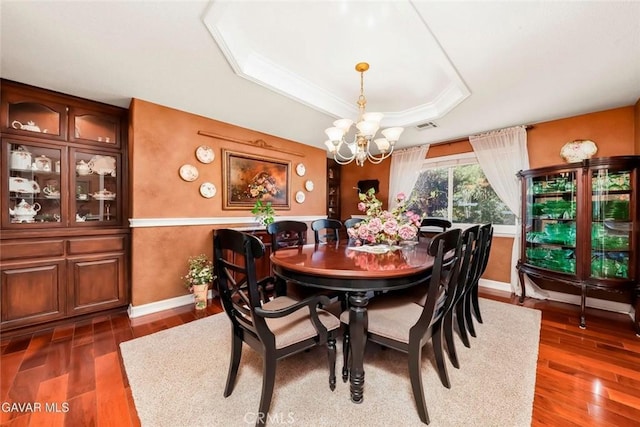 40505 90th St W, Palmdale, CA 93551 - dining room with a tray ceiling, a chandelier, and wood finished floors