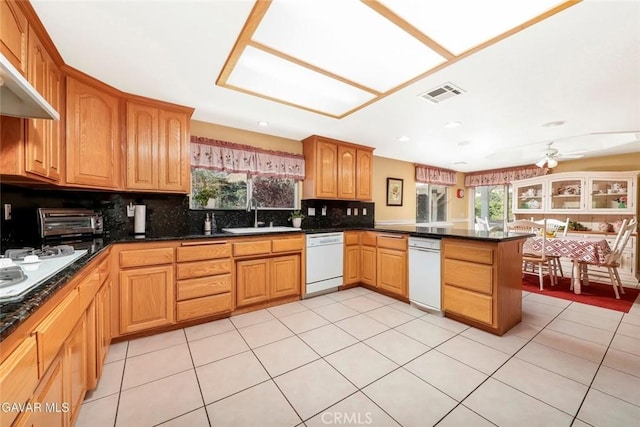 40505 90th St W, Palmdale, CA 93551 - kitchen featuring white appliances, a peninsula, backsplash, ceiling fan, and light tile patterned floors