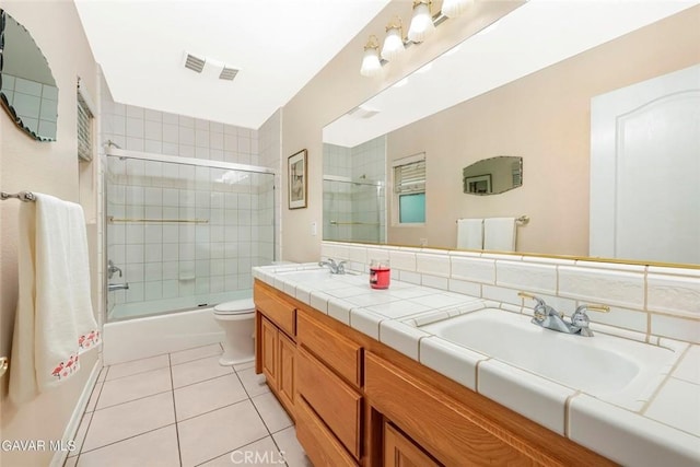 40505 90th St W, Palmdale, CA 93551 - full bathroom featuring tile patterned flooring, double vanity, and combined bath / shower with glass door