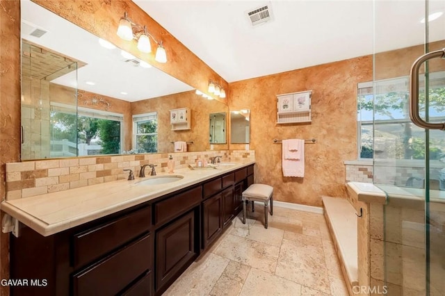 40505 90th St W, Palmdale, CA 93551 - full bath with double vanity, a bath, tasteful backsplash, and stone tile flooring