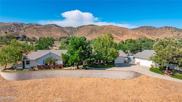 40505 90th St W, Palmdale, CA 93551 - view of front of property with a garage, a mountain view, a tile roof, and concrete driveway