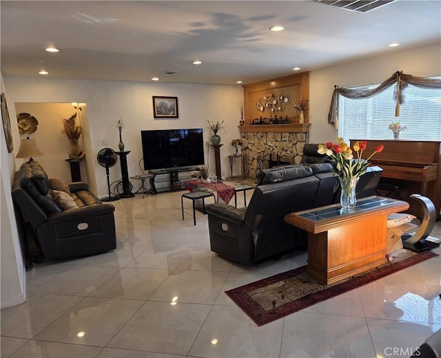 15901 Lassen St, North Hills, CA 91343 - living area featuring recessed lighting, a fireplace, and light marble finish flooring