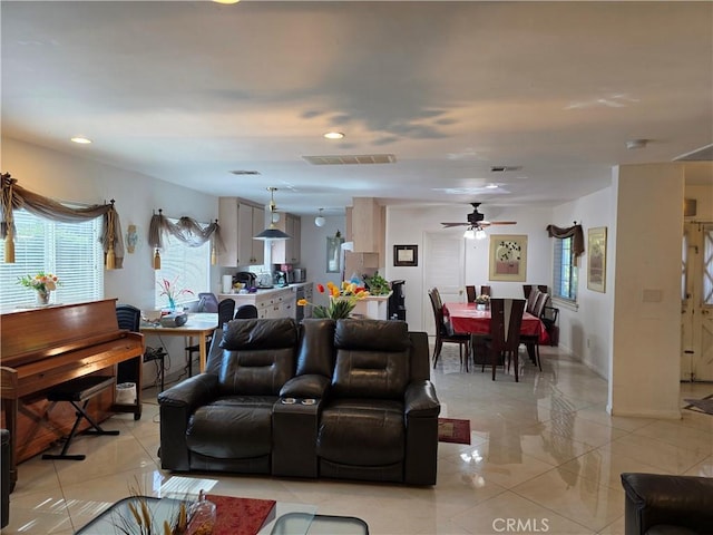 15901 Lassen St, North Hills, CA 91343 - living area with healthy amount of natural light, a ceiling fan, light tile patterned flooring, and recessed lighting