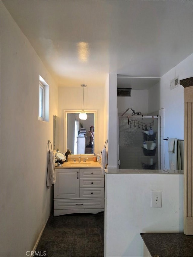 15901 Lassen St, North Hills, CA 91343 - kitchen featuring white cabinetry and decorative light fixtures