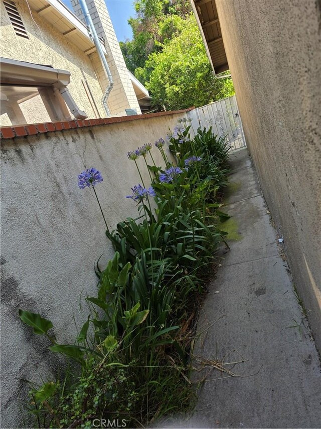 15901 Lassen St, North Hills, CA 91343 - view of side of home with stucco siding