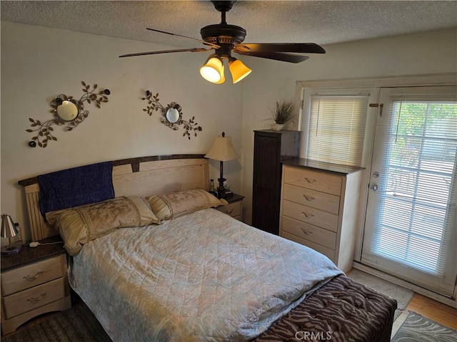 15901 Lassen St, North Hills, CA 91343 - bedroom with a textured ceiling, a ceiling fan, and wood finished floors