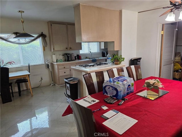15901 Lassen St, North Hills, CA 91343 - kitchen featuring light countertops, a ceiling fan, white gas stovetop, and hanging light fixtures