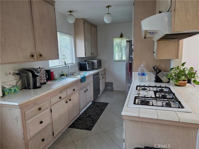 15901 Lassen St, North Hills, CA 91343 - kitchen featuring appliances with stainless steel finishes, extractor fan, light brown cabinets, light tile patterned floors, and tile counters