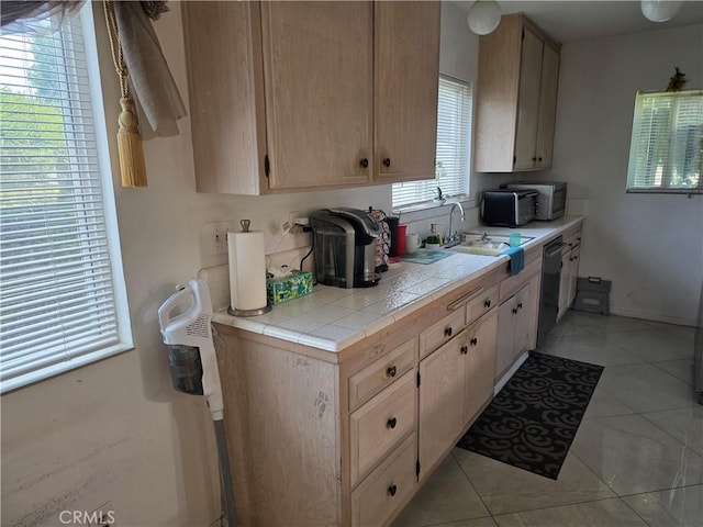 15901 Lassen St, North Hills, CA 91343 - kitchen featuring tile counters, light tile patterned floors, appliances with stainless steel finishes, and light brown cabinets