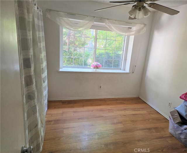 15901 Lassen St, North Hills, CA 91343 - empty room with wood finished floors and ceiling fan