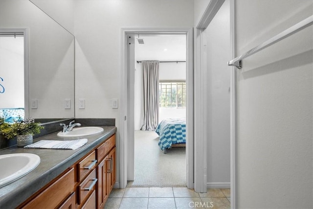18330 Hanan Ct, Tarzana, CA 91356 - ensuite bathroom featuring double vanity and tile patterned floors