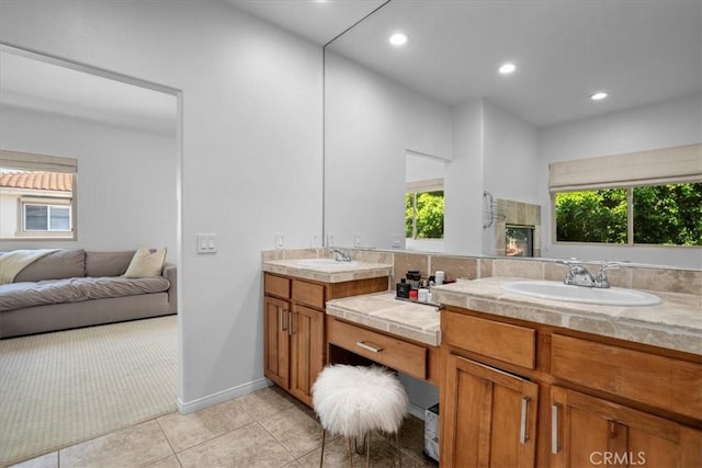18330 Hanan Ct, Tarzana, CA 91356 - bathroom featuring double vanity, tile patterned floors, plenty of natural light, recessed lighting, and connected bathroom