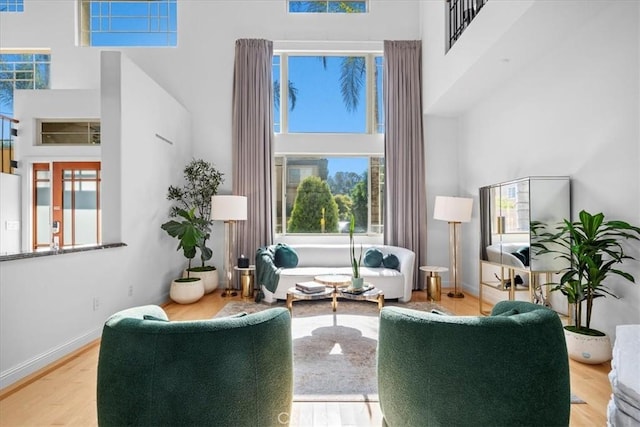 18330 Hanan Ct, Tarzana, CA 91356 - living area featuring a high ceiling, plenty of natural light, and wood finished floors