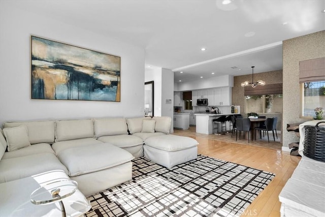 18330 Hanan Ct, Tarzana, CA 91356 - living area featuring light wood-style flooring, a chandelier, and recessed lighting