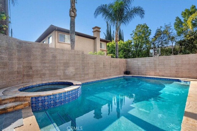 18330 Hanan Ct, Tarzana, CA 91356 - view of pool featuring a fenced backyard and a pool with connected hot tub