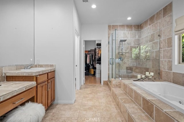 18330 Hanan Ct, Tarzana, CA 91356 - full bath with a shower stall, a tub with jets, vanity, a spacious closet, and tile patterned floors
