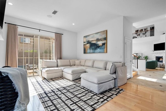 18330 Hanan Ct, Tarzana, CA 91356 - living area featuring wood finished floors, recessed lighting, and a fireplace