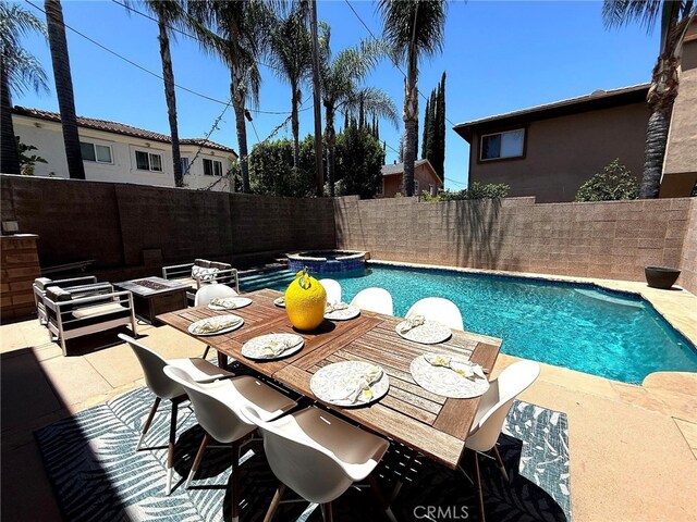 18330 Hanan Ct, Tarzana, CA 91356 - view of pool with a fenced backyard, a patio, a fire pit, and a pool with connected hot tub