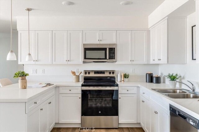 3802 Ranch House Rd Unit 102, San Luis Obispo, CA 93401 - kitchen featuring appliances with stainless steel finishes, a peninsula, and white cabinetry