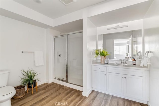3802 Ranch House Rd Unit 102, San Luis Obispo, CA 93401 - bathroom featuring a shower stall, vanity, and wood finished floors