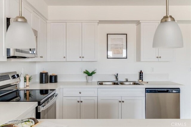 3802 Ranch House Rd Unit 102, San Luis Obispo, CA 93401 - kitchen featuring stainless steel appliances, white cabinetry, light countertops, and exhaust hood