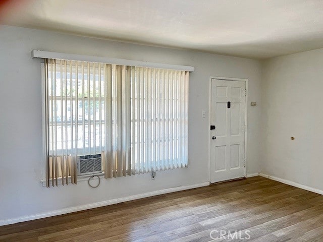 122 Elm Ave Unit 9, Long Beach, CA 90802 - entrance foyer featuring wood finished floors and cooling unit