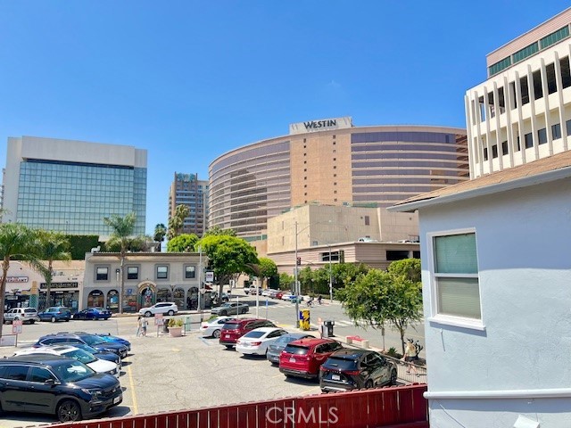 122 Elm Ave Unit 9, Long Beach, CA 90802 - uncovered parking lot featuring a view of city