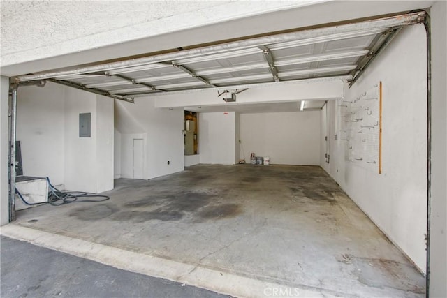 15118 Ocaso Ave, La Mirada, CA 90638 - garage with a garage door opener and electric panel