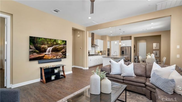 126 Luneta Ln, Rancho Mission Viejo, CA 92694 - living area featuring dark wood-type flooring and recessed lighting