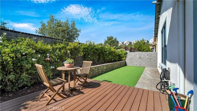 126 Luneta Ln, Rancho Mission Viejo, CA 92694 - deck with an area to practice putting and a fenced backyard