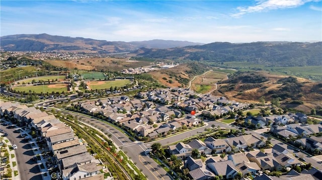 126 Luneta Ln, Rancho Mission Viejo, CA 92694 - aerial view of property and surrounding area with a mountain backdrop and nearby suburban area