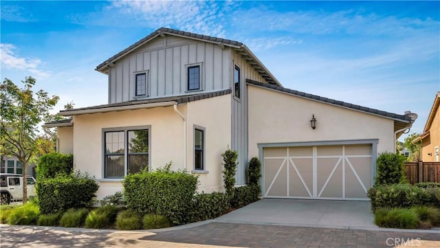 126 Luneta Ln, Rancho Mission Viejo, CA 92694 - view of front of house with driveway, board and batten siding, stucco siding, and a garage