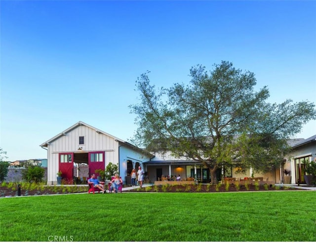126 Luneta Ln, Rancho Mission Viejo, CA 92694 - view of front facade featuring board and batten siding and a front lawn