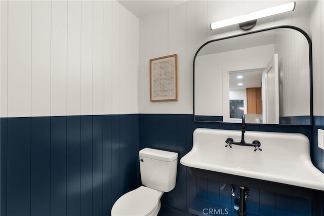 20371 Allport Ln, Huntington Beach, CA 92646 - bathroom featuring toilet and a wainscoted wall