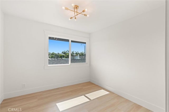 20371 Allport Ln, Huntington Beach, CA 92646 - spare room with a chandelier and wood finished floors