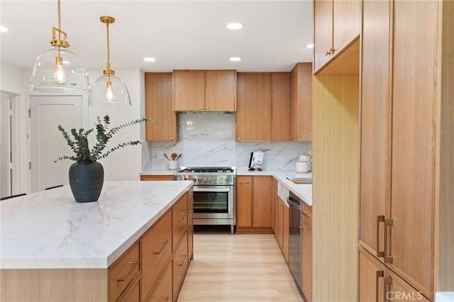 20371 Allport Ln, Huntington Beach, CA 92646 - kitchen with stainless steel appliances, light wood-style floors, decorative backsplash, a kitchen island, and decorative light fixtures