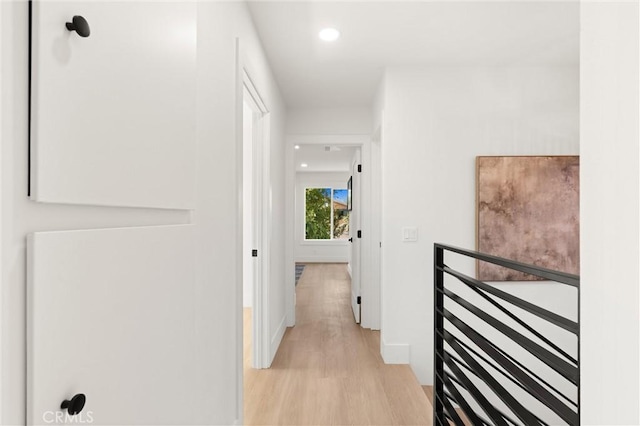 20371 Allport Ln, Huntington Beach, CA 92646 - corridor with light wood-type flooring, an upstairs landing, and recessed lighting