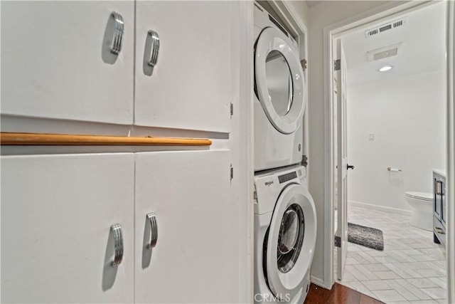 1525 N Hayworth Ave Unit 205, Los Angeles, CA 90046 - washroom featuring estacked washer and dryer