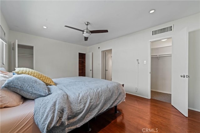 1525 N Hayworth Ave Unit 205, Los Angeles, CA 90046 - bedroom with wood finished floors, a spacious closet, recessed lighting, and ceiling fan