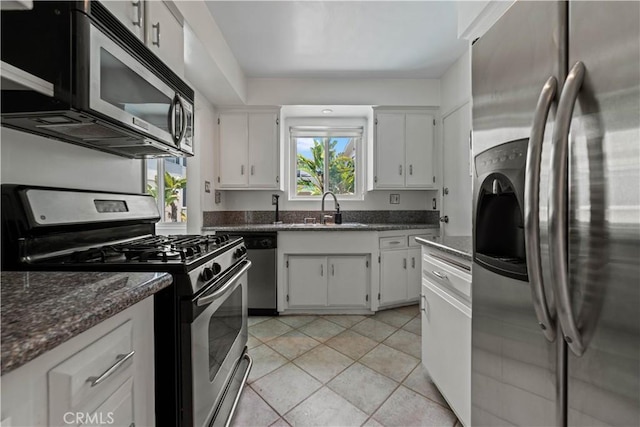 1525 N Hayworth Ave Unit 205, Los Angeles, CA 90046 - kitchen with appliances with stainless steel finishes, healthy amount of natural light, and white cabinetry
