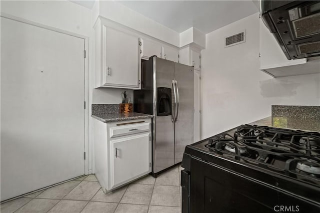 1525 N Hayworth Ave Unit 205, Los Angeles, CA 90046 - kitchen with gas stove, stainless steel refrigerator with ice dispenser, white cabinetry, and extractor fan